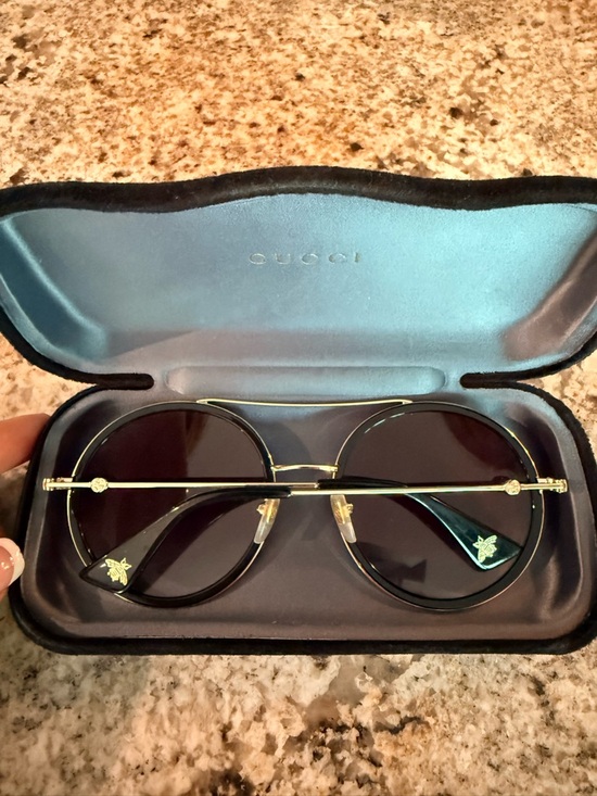 Gucci Women\'s Round Sunglasses in Black with Gold Detail